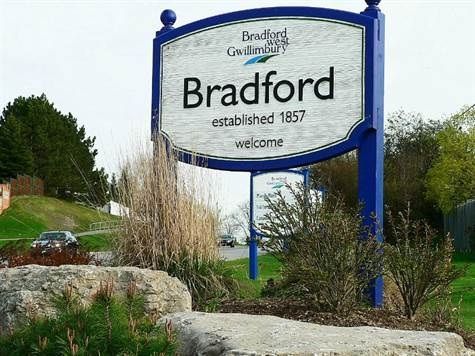 Bradford West Gwillimbury town sign; Van Blanc delivers sea cans and storage containers to Bradford and the Holland Marsh.