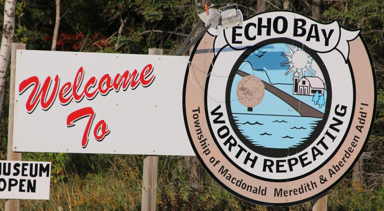 Welcome to Echo Bay sign east of Sault Ste Marie; Van Blanc brings shipping containers to the Algoma District.