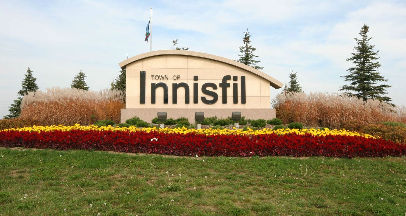 Innisfil, Ontario welcome sign by Lake Simcoe; Van Blanc delivers shipping containers to Alcona, Lefroy, and rural Innisfil.