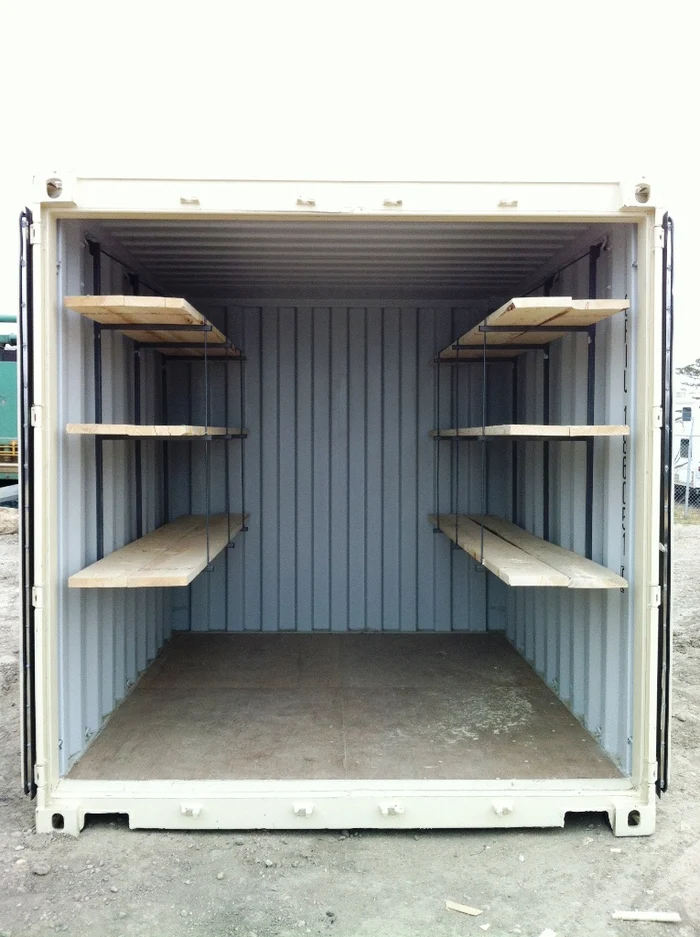 Instant shelving brackets installed in a short cube shipping container