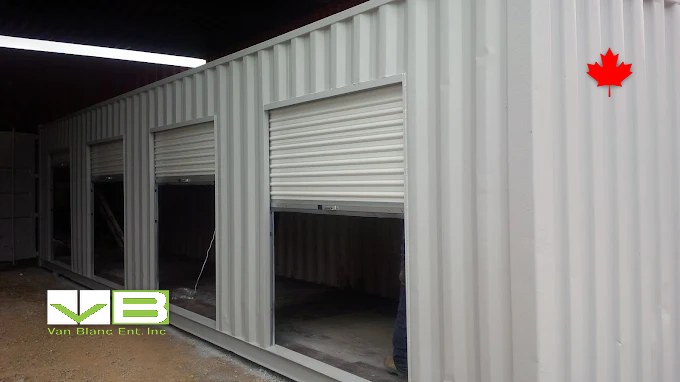 Lined and insulated container interior fitted as a finished workshop room.