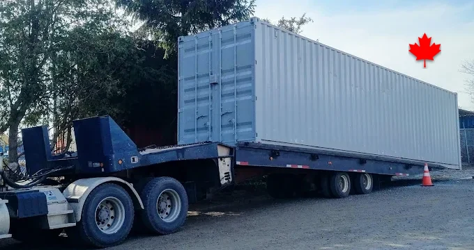 A 40ft container riding the delivery trailer on an Ontario road