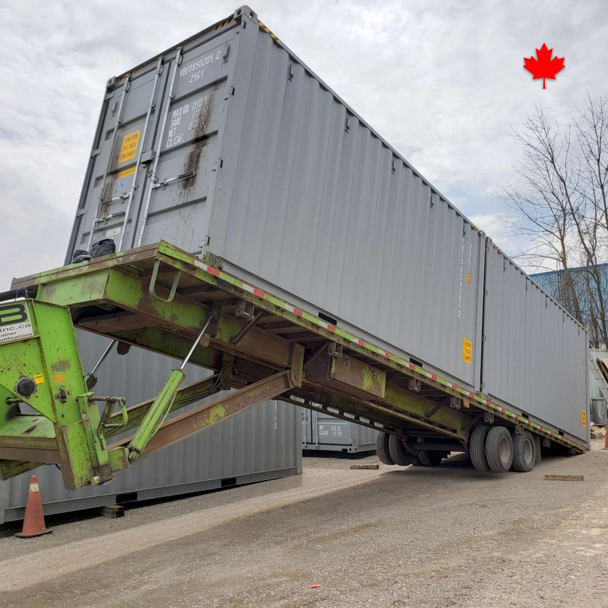 A grey 40ft high cube coming off the tilt-deck at Van Blanc in Brantford