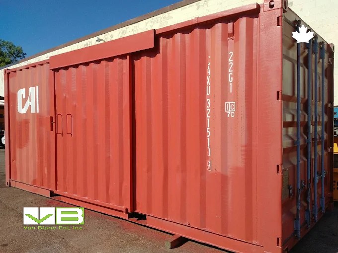 Red 20ft unit with a sliding side door standing on an asphalt lot in morning light.