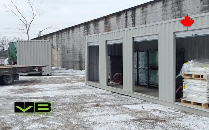 Open storage bays holding palletized stock at the Brantford yard, light snow on the ground