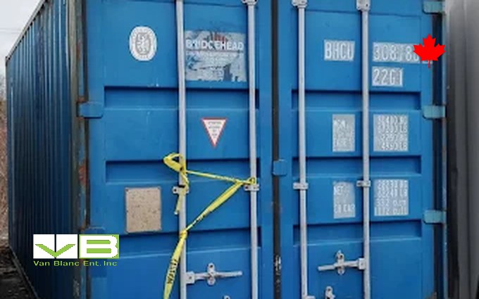 A used blue shipping container with its cargo doors closed, standing in the Brantford yard