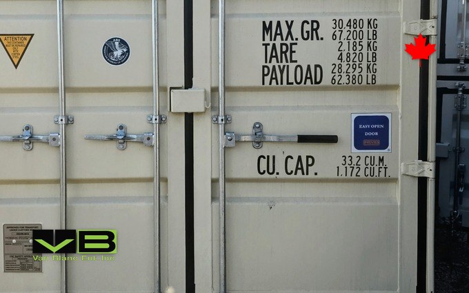 The single black-grip easy-open lever and its patented-door decal on a new 20-foot container