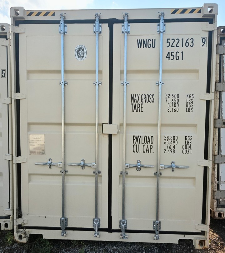 Waist-high door handles on a beige one-trip 40-foot high cube, all four rods carrying raised levers